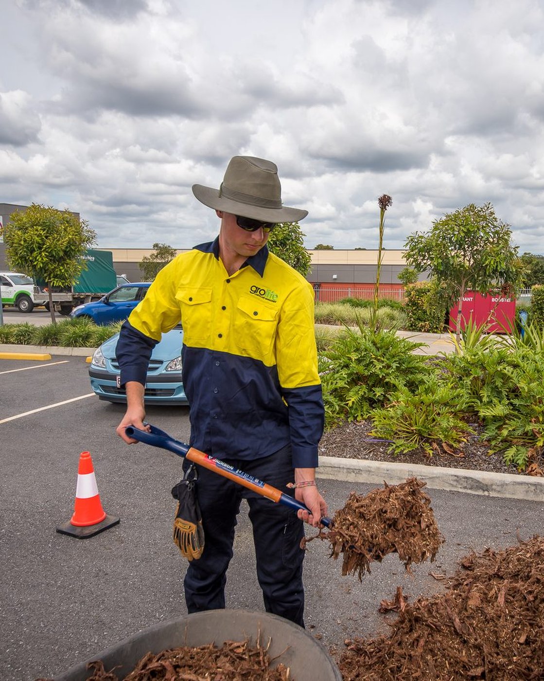 A Grolife crew working on a garden bed makeover at a commercial site